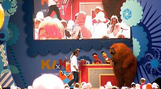 Besetztes Audimax auf der Sesamstraße. Magnus Klaue auf dem Podium (mittig in orange). <br/>Foto von mwboeckmann, Flickr.